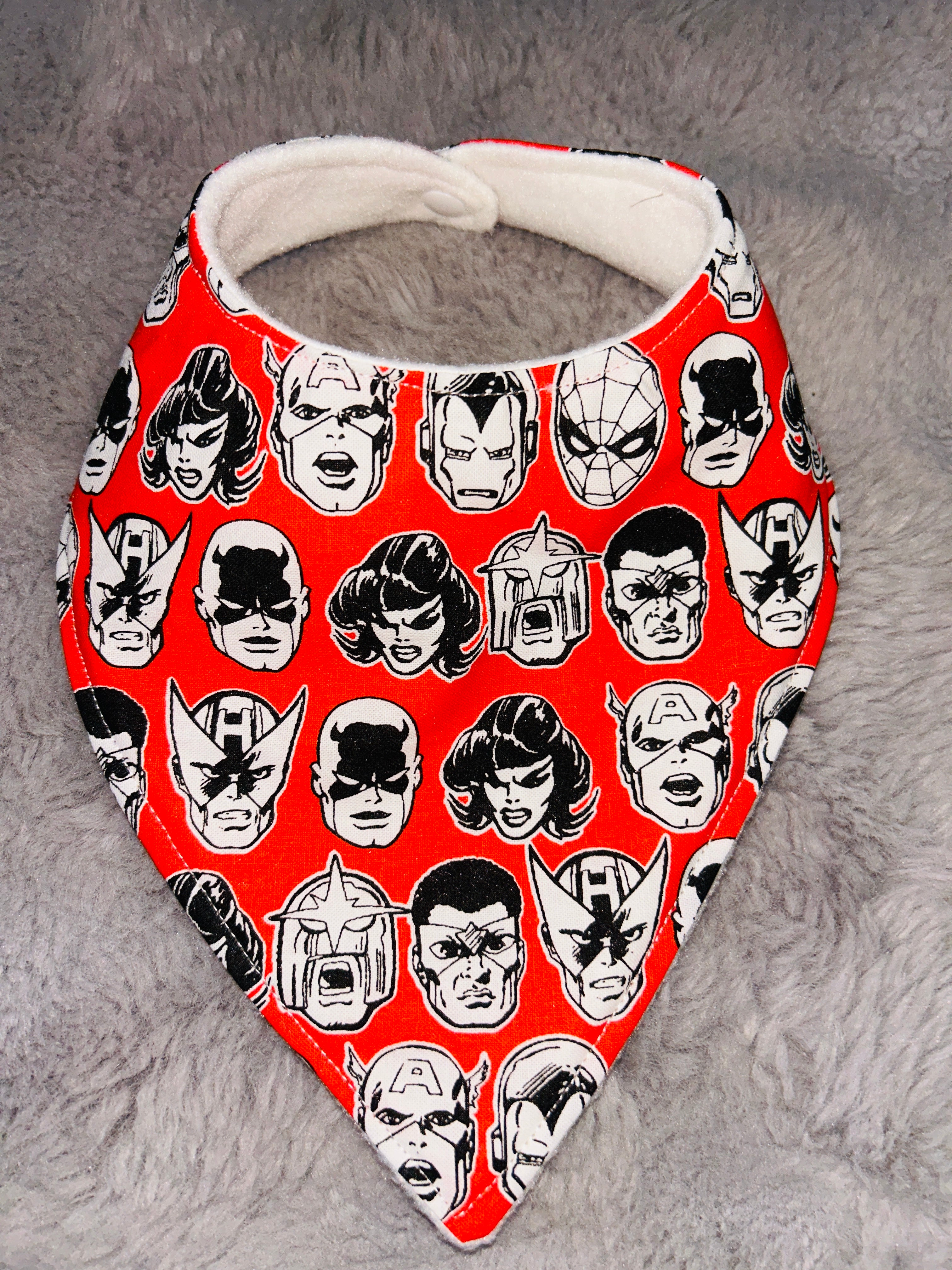 Red superhero’s dribble bib