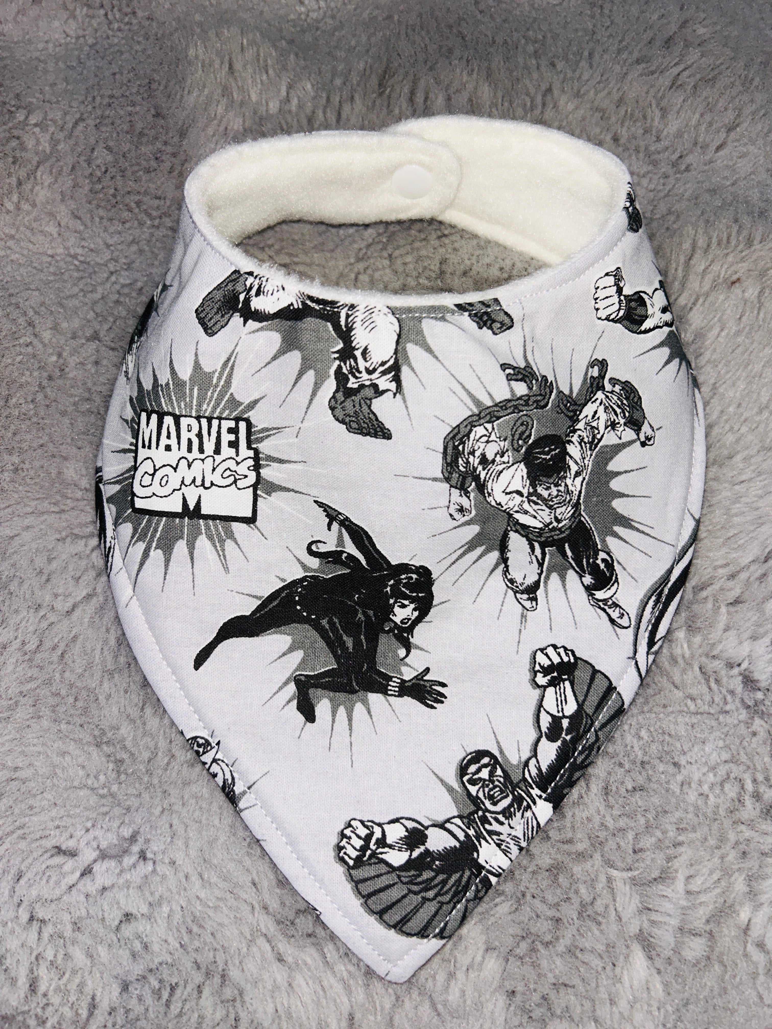Grey superhero’s dribble bib